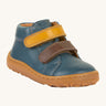Froddo barefoot first step baby shoe in dark denim. A dark blue natural leather shoe with a 2 velcro fastener in dark yellow and brown for a secure fit. Features a light brown grippy sole