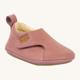 Froddo barefoot walker baby shoe in dark pink. A natural leather shoe with a pull tab on the back for easy fitting, a velcro fastener and a grippy sole