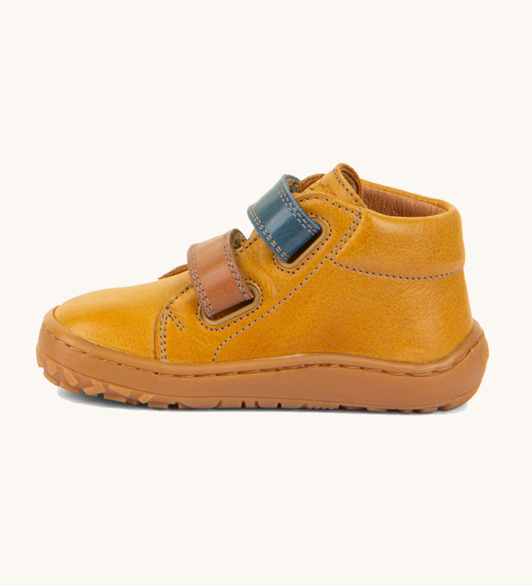 Froddo barefoot first step baby shoe in mustard available at Babipur showing the 2 velcro fastener for a secure fit in blue and brown and the grippy sole