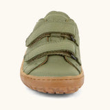 Front of the Froddo barefoot base children's shoe in green showing the 2 velcro fasteners and the brown grippy sole detail