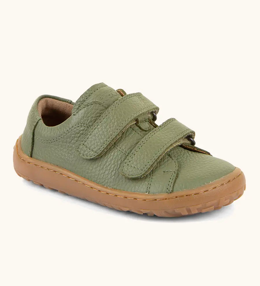 Froddo barefoot base children's shoe in green. A natural leather low profile shoe showing 2 velcro fasteners and a grippy sole