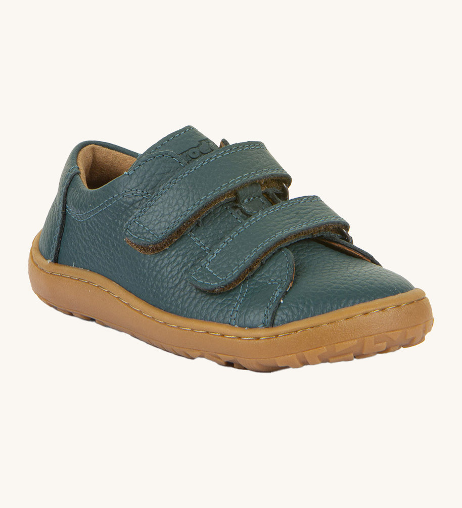 Froddo barefoot base children's shoe in petroleum. A dark turquoise natural leather low profile shoe with a 2 velcro fastener for a secure fit and a grippy sole