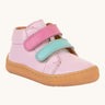 Froddo first step shoes in pink available at Babipur. A soft ankle high natural leather shoe in light pink with 2 velcro straps on the front in dark pink and light blue. Features a light brown rubber grippy sole and a padded ankle support.