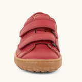 Front of the Froddo barefoot base children's shoe in red showing the 2 velcro fasteners and the brown grippy sole detail