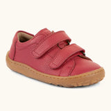 Froddo barefoot base children's shoe in red. A natural leather low profile shoe showing 2 velcro fasteners and a grippy sole