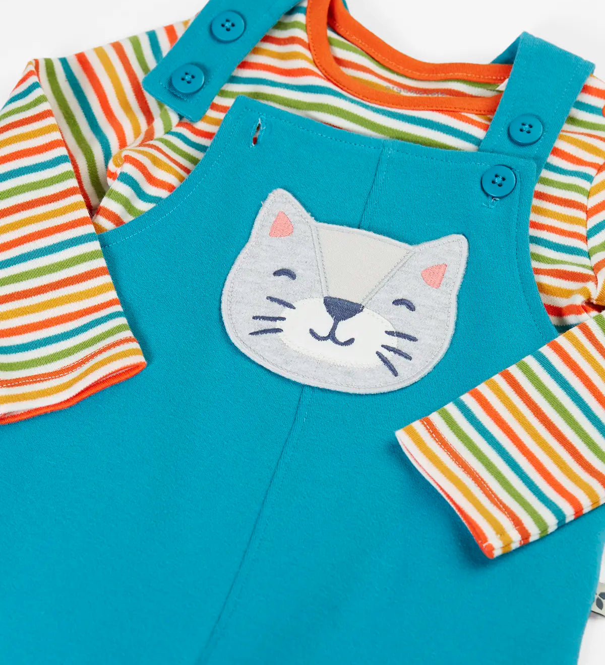 Frugi GOTS organic cotton dungaree outfit in light bluewith a cat applieque showing the adjustable shoulder straps