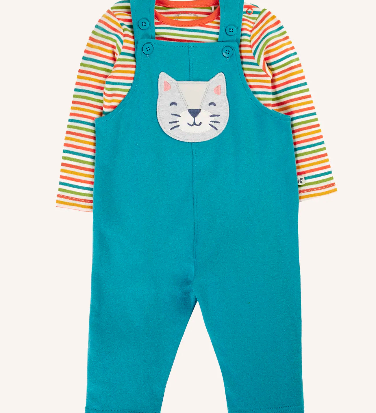 Frugi ruan dungaree outfit with a boat blue dungarees with a wild cat applique on the front and a rainbow stripe long sleeve top. 