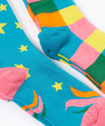 A close up of the Frugi 2 pack rainbow brilliant boot socks showing the pink and light blue heal detail on organic cotton fabric