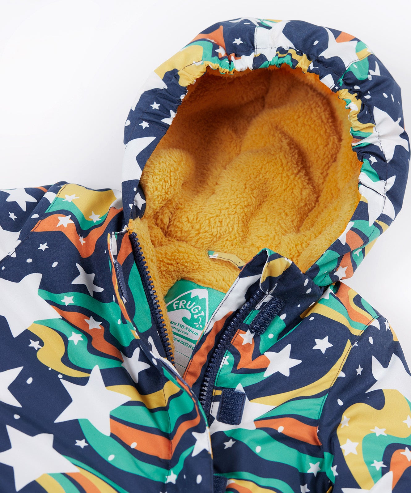 A close up of the Frugi 2 in 1 rambler  coat in magic stars. Showing the yellow fleece inner liner on the hood and zip detail.