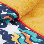 A close up of the Frugi 2 in 1 rambler coat and trousers in magic stars. Showing the yellow fleece inner liner and red zip detail separating the coat and trouser
