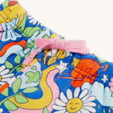 A closer look at the light pink drawcord on the Frugi Snuggle Crawlers - Retro Happy. The image also shows the retro happy print of the trousers