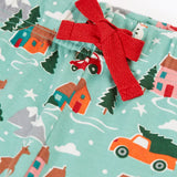 Close up of the red waist tie on the Frugi adults organic cotton perranporth pyjamas with a festive winter drives print on a light moss green background. 