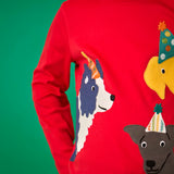 Close up of a child wearing the Frugi organic cotton adventure circular long sleeve top scarlet red with three dogs wearing party hats on the front. 