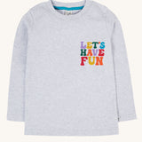 The front of the Frugi Adventure Organic Cotton Printed Kids' grey Top. The words let's have fun in multi coloured letters on the chest. 