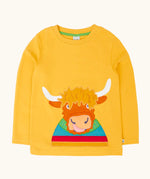 Frugi adventure circular cotton top in bumblebee yellow with a Highland cow applique on the front.