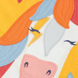 Zoomed in view of the horse applique on the font of the Frugi adventure circular organic cotton long sleeve top in bumblebee yellow.
