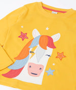 Close up of the Frugi adventure circular organic cotton long sleeve top in bumblebee yellow with a white horse applique with a rainbow mane on the front surrounded by stars.