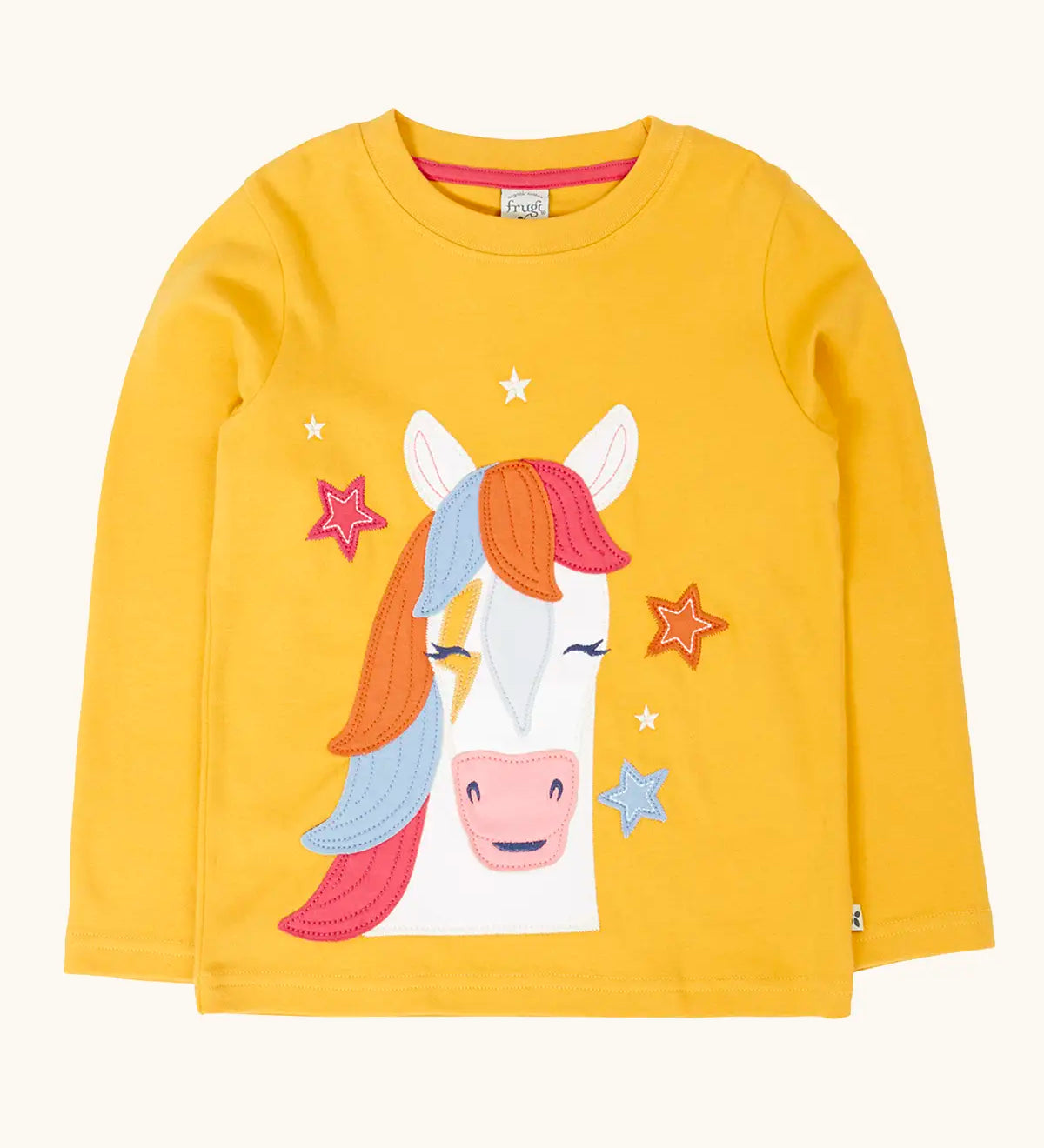 Frugi adventure circular organic cotton long sleeve top in bumblebee yellow with a white horse applique with a rainbow mane on the front surrounded by stars. 