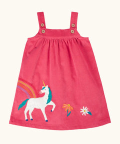 Frugi agatha organic cotton pink corduroy pinafore child's dress with unicorn applique and rainbow and flower details along the hemline.