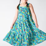 A smiling young child wearing the Frugi Alani Midi Dress featuring a Sea Life print, twirling the dress around.