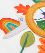 A close up of the snail embroidered snail applique Frugi organic cotton Alfie interactive long sleeved top.