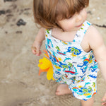 A child wearing the Frugi Aloha Baxter Dungaree.