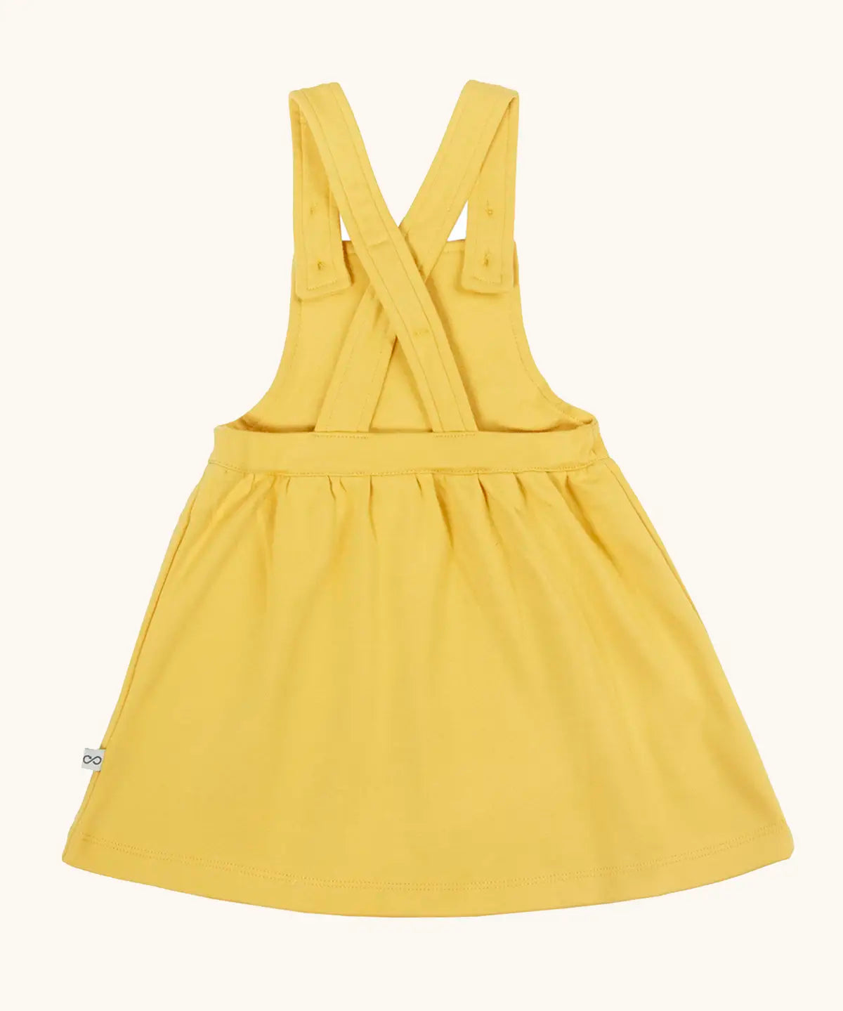 Frugi Ania pineafore dress in a warm yellow with adjustable cross straps, made from organic cotton.