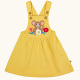 Frugi Ania bumblebee yellow pinafore dress with mouse and flowers applique on the front.