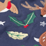 A close up of the embroidered holly detail on the front of the Frugi navy reindeer applique  Organic Cotton Anna long sleeved Top. This top is a part of a wide range of organic cotton clothing for children available here at Babipur.  
