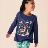 A close up of a child wearing the Frugi navy reindeer Anna top available at Babipur showing the reindeer and woodland animal appliques
