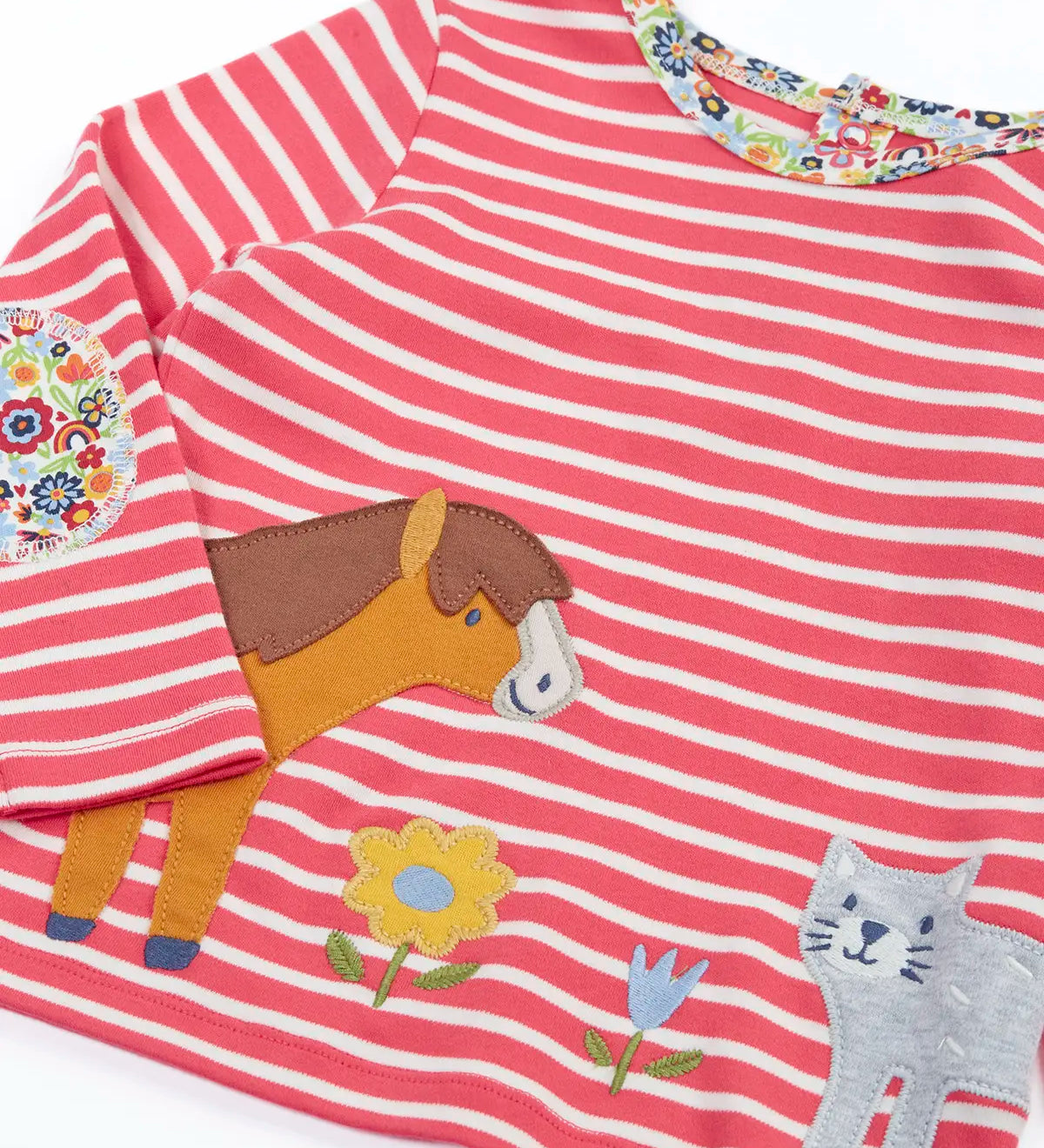 Close up of the Frugi Archer horse and cat applique top in a pink rhubarb Breton stripe and floral neck trim and elbow patches.