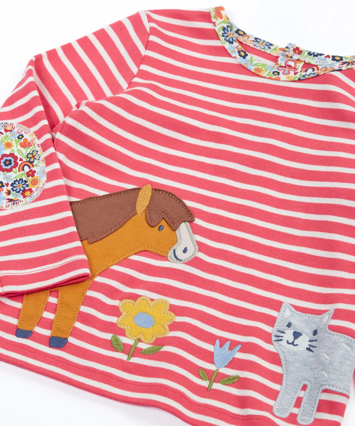Close up of the Frugi Archer horse and cat applique top in a pink rhubarb Breton stripe and floral neck trim and elbow patches.