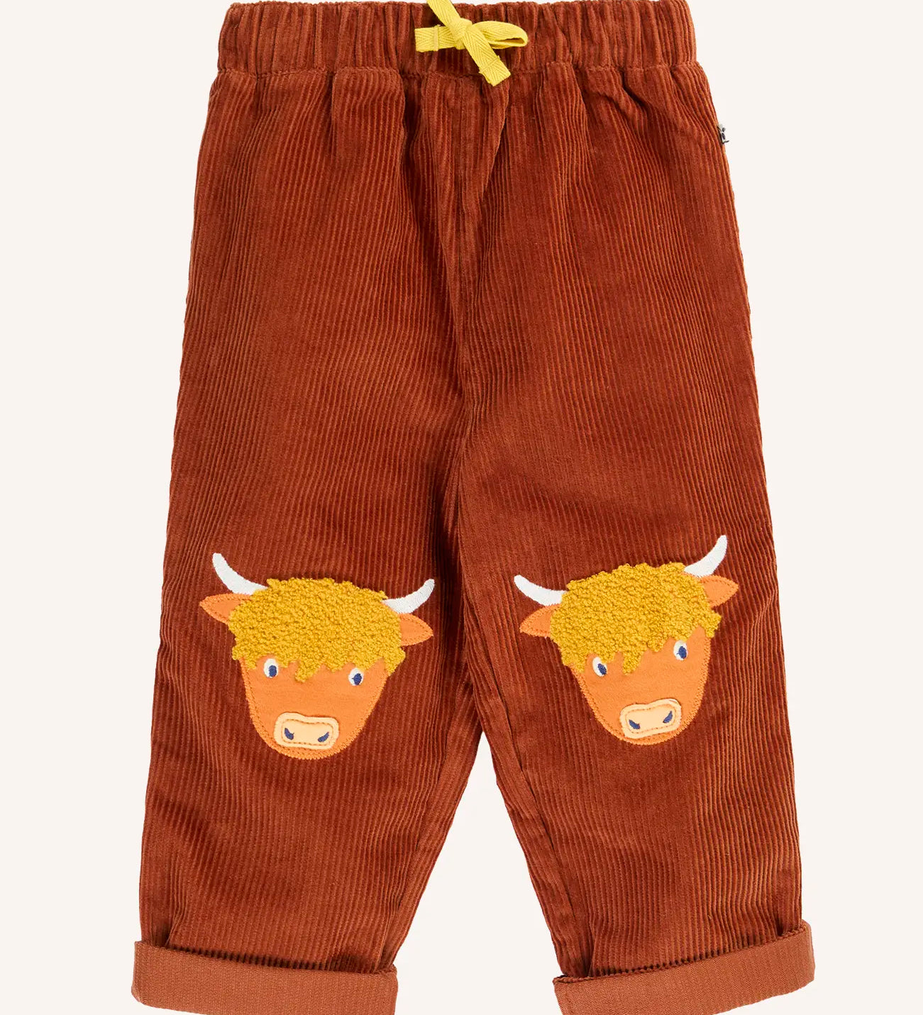 Frugi Arlo rust brown cord trousers with highland cow knee patch appliques. 