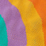 Close up of the knit on the Frugi Aubrey organic cotton knitted jumper with a hotchpotch rainbow design.