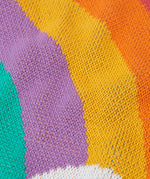 Close up of the knit on the Frugi Aubrey organic cotton knitted jumper with a hotchpotch rainbow design.