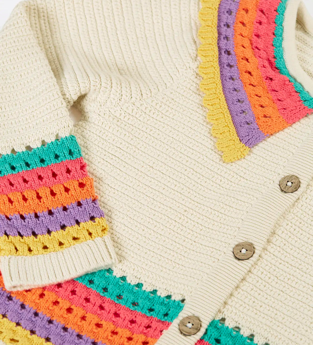 Frugi aurora collar cardigan in natural cream with rainbow stripe detail on bottom, cuffs and collar.
