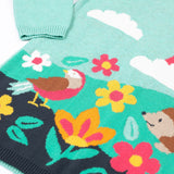A close up of the design on the Frugi ava blue marl rainbow knitted children's dress.