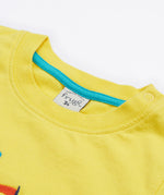A close up of A close up of Frugi Avery Appligue T-Shirt in Welly Yellow's embroidered collar.