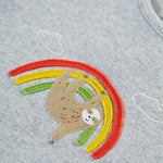 A close up view of the sloth and rainbow applique on the grey top of the Frugi Children's GOTS Organic Cotton Frankie Summer Outfit - Sleepy Sloths.