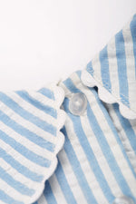 Close up of the neck button closure on the Frugi Beach Hut Blue and white Stripe Cassie Collared Dress