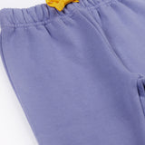 A close up of the yellow gold coloured waist tie on the Frugi bear character grape purple coloured children's crawlers.
