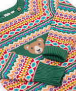 A close up of the Frugi fowey bear fairisle organic cotton knitted jumper with the sleeves folded in. The sleeve cuffs are a dark green colour.