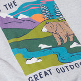 A close up of the Frugi kids ben colour block hopscotch/fun hoodie showing a mountain scene print with a brown bear on the back on organic cotton fabric.