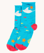 The blue sting ray socks from the Frugi pack of three sealife themed bamboo children's socks with roll tops. A blue under the ocean themed sock with sting ray, starfish, fish and coral pink coloured heel and toe caps. 