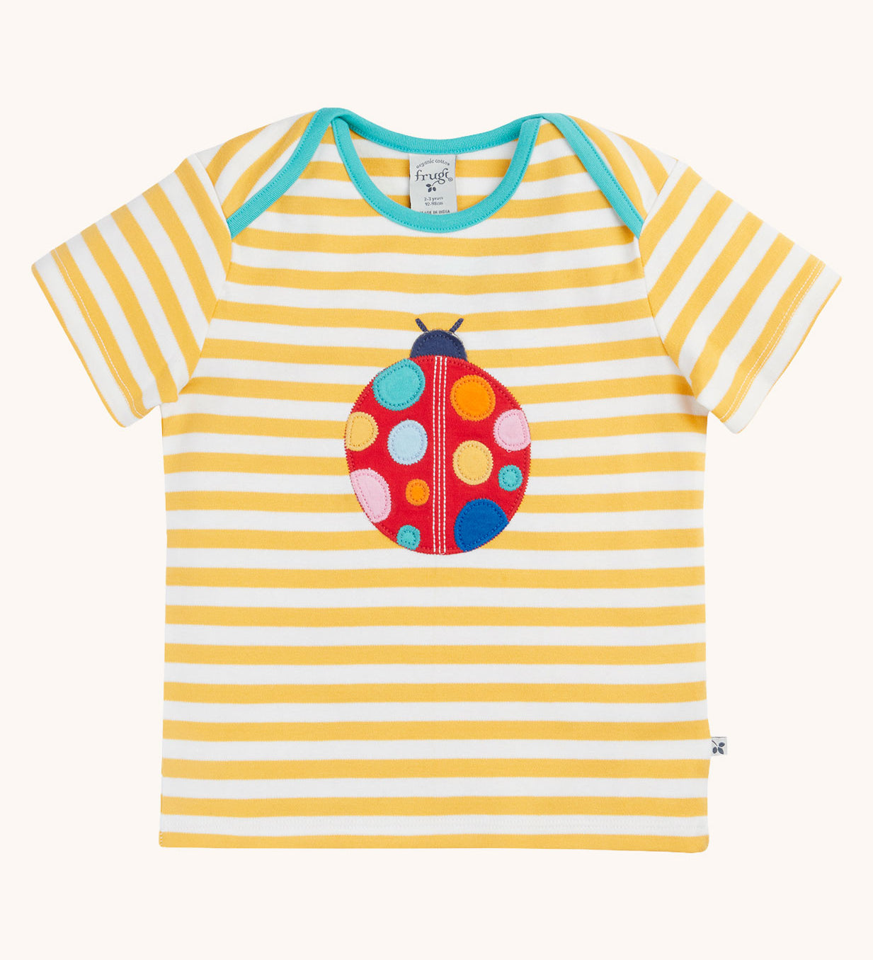 Frugi yellow striped short sleeve t-shirt with ladybird applique on the front. The ladybird has rainbow coloured dots.