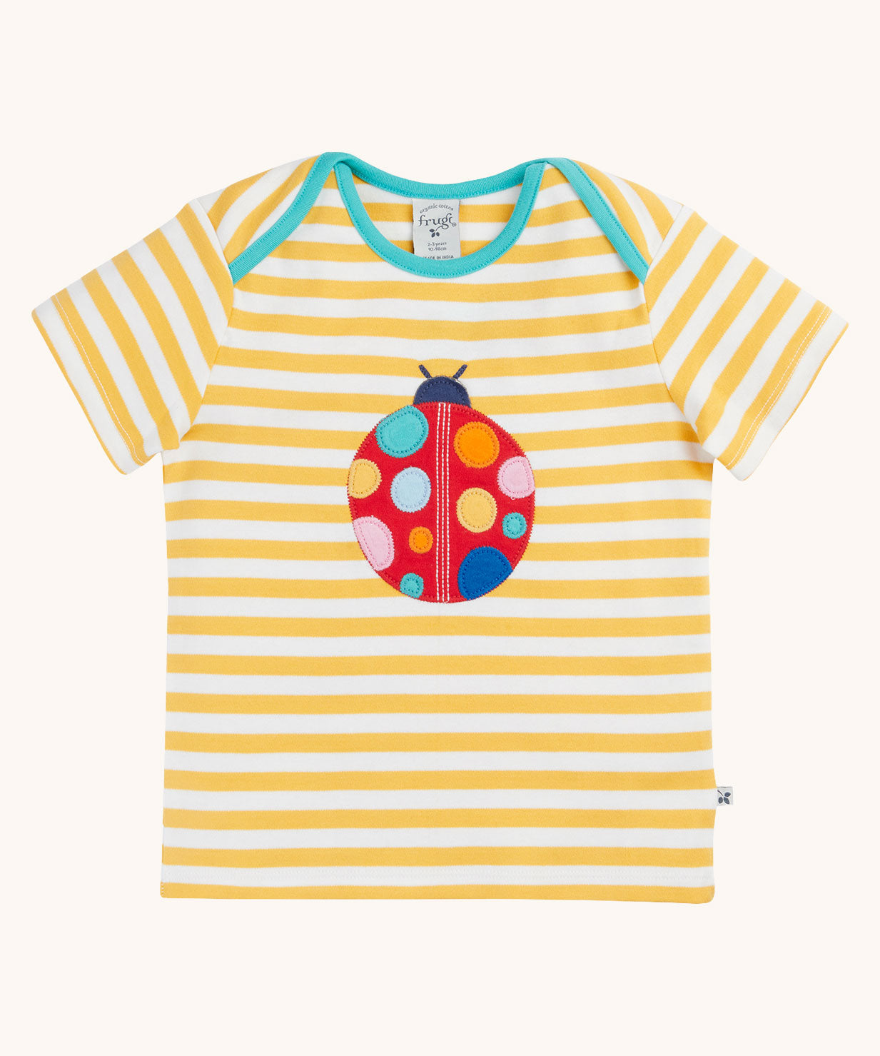 Frugi yellow striped short sleeve t-shirt with ladybird applique on the front. The ladybird has rainbow coloured dots.