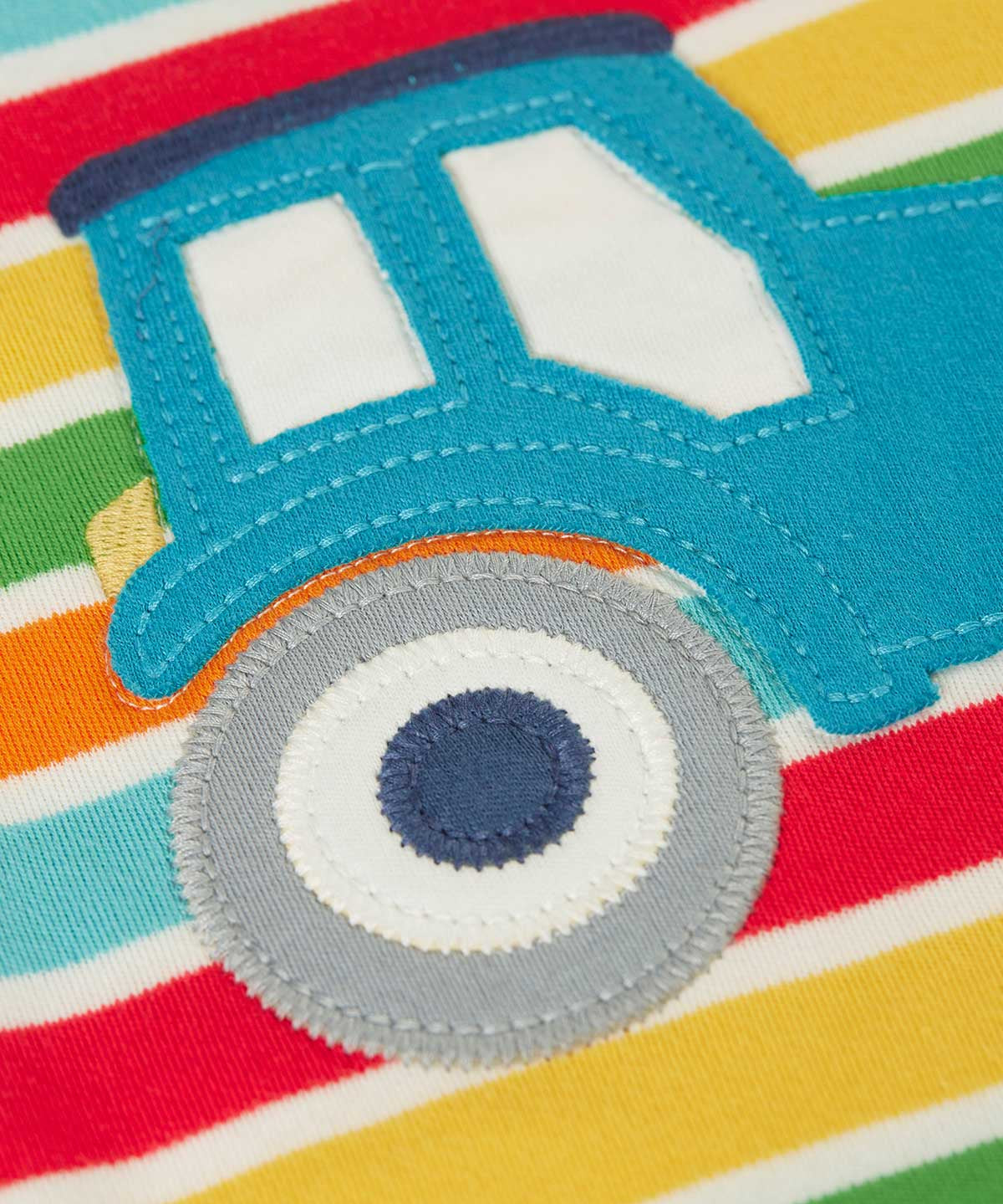 A super close up of the wheels on the tractor applique showing the stitched details. 