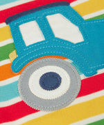 A super close up of the wheels on the tractor applique showing the stitched details. 