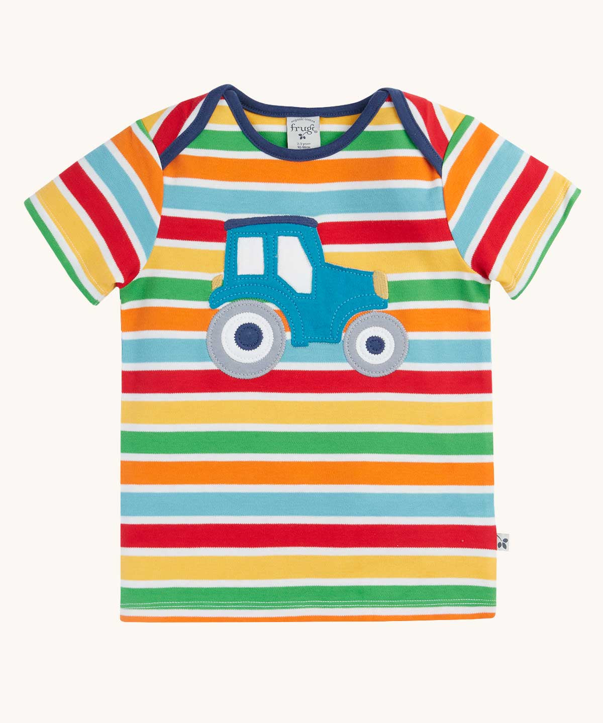 Frugi blue tractor applique rainbow striped t-shirt. Bands of red, light yellow, green, orange and light blue in-between thinner white stripes.