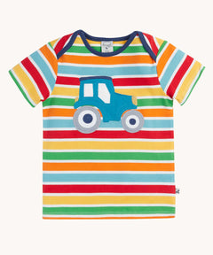 Frugi blue tractor applique rainbow striped t-shirt. Bands of red, light yellow, green, orange and light blue in-between thinner white stripes.